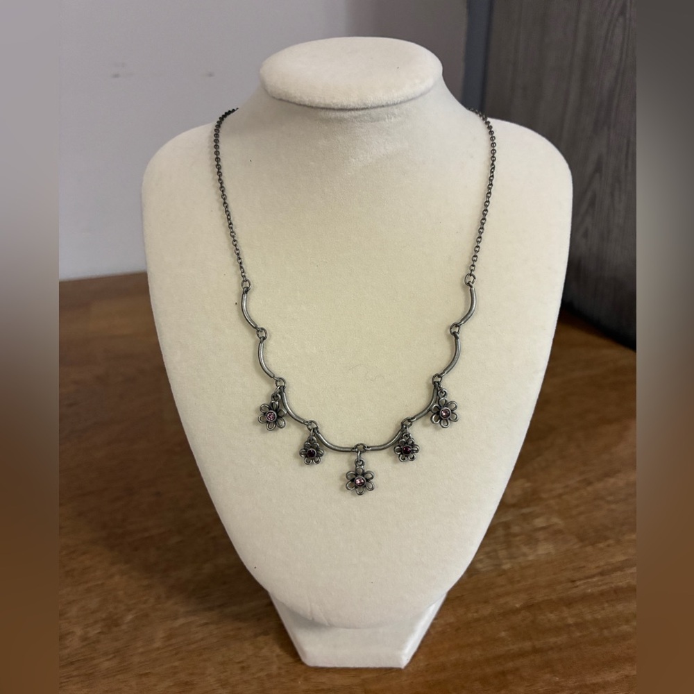 Pewter-tone finish with five hanging floral charmseach set purple crystal